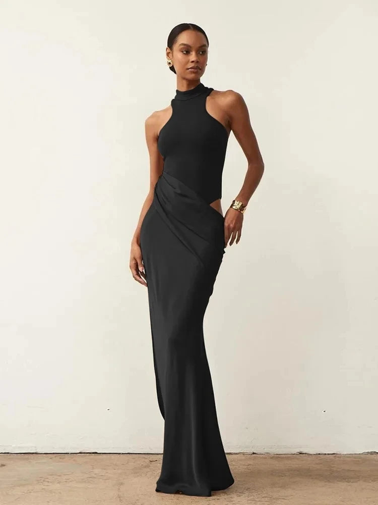 Vestido Negro Satinado de un Hombro con Abertura.